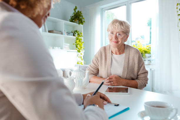 istock Senior woman talking with financial advisor 1088950800