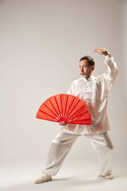 istock Senior master practicing qi qong taijiquan 1088952288