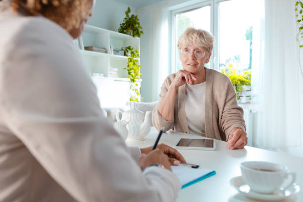 istock Senior woman talking with insurance advisor 1088952448