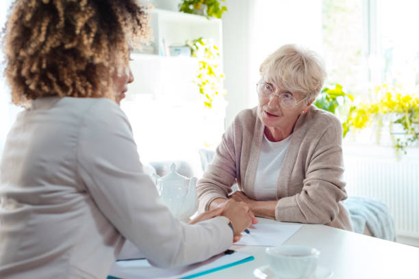 istock Senior woman talking with insurance advisor 1088952624