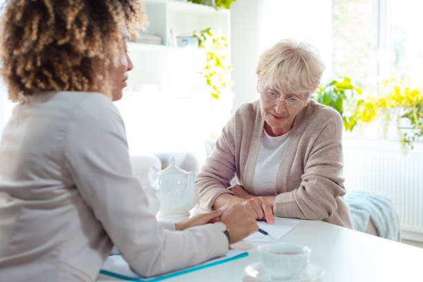 istock Senior woman talking with insurance advisor 1088952772