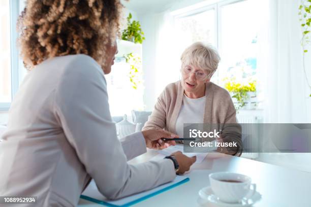 Senior Woman Talking With Nutritionist Stock Photo - Download Image Now - Assistance, Diabetes, Financial Advisor