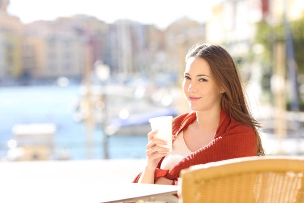istock Confident woman on vacation posing in a bar 1088955056