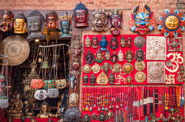 Colorful carved wooden masks and handicrafts on the traditional market in Thamel District of Kathmandu, Nepal Colorful carved wooden masks and handicrafts on the traditional market in Thamel District of Kathmandu, Nepal thamel stock pictures, royalty-free photos & images