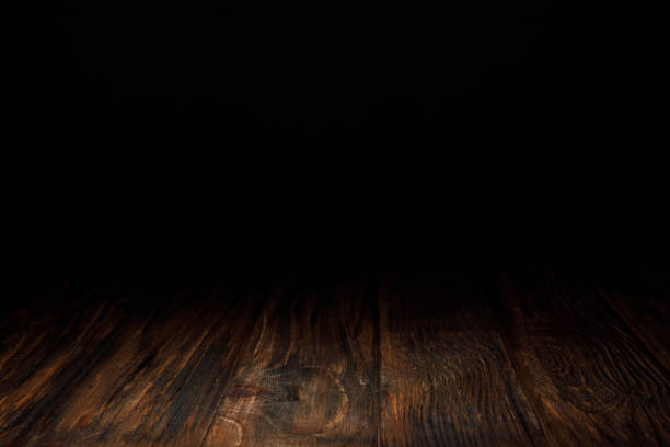 istock dark brown striped wooden background on black 1088958122