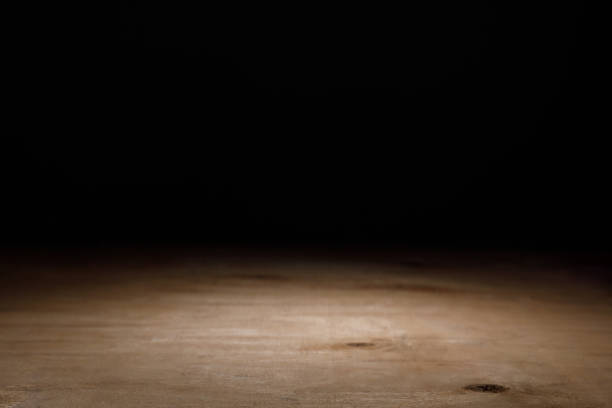 istock brown wooden textured surface on black 1088958128