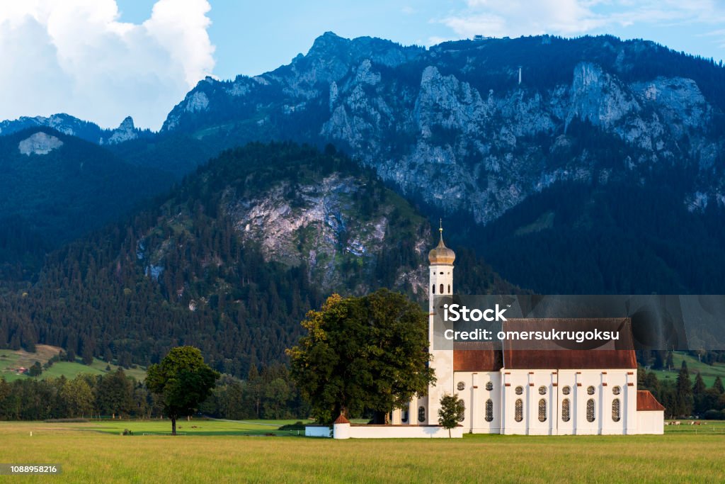 Idyllic St Coloman Church in Allgau, Bavarian Alps at summer, Germany Idyllic St Coloman Church in Allgau, Bavarian Alps at summer, Germany. Church Stock Photo