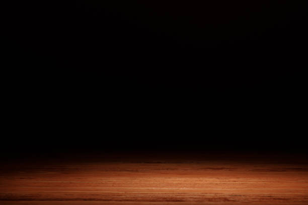 istock orange striped wooden surface on black 1088958262