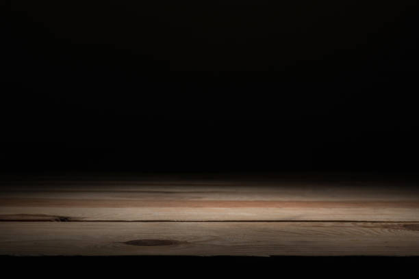 istock brown striped wooden surface on black 1088958306