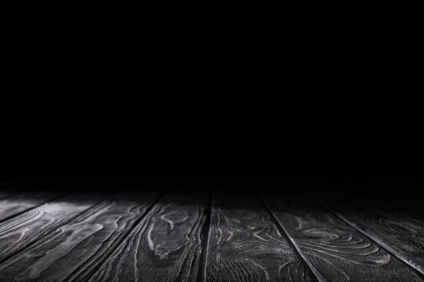 istock dark grey striped wooden material on black 1088958314