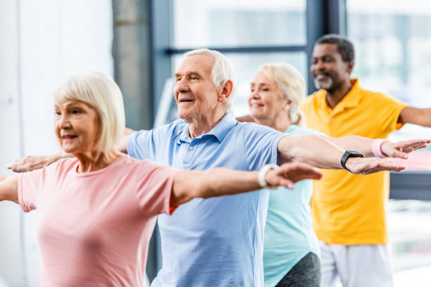 istock happy multicultural senior athletes synchronous doing exercise at gym 1088958454