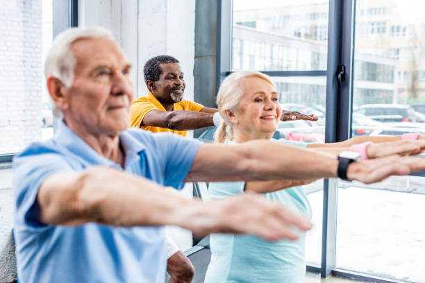 istock selective focus of multicultural senior athletes synchronous doing exercise at gym 1088958532