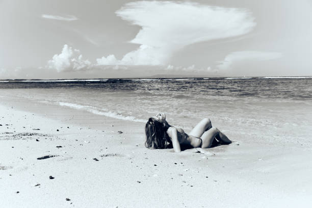 istock Slim woman enjoying on a sandy tropical beach. 1088959140