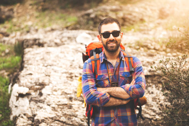 istock young mountaineer with sunglasses in nature 1088961500