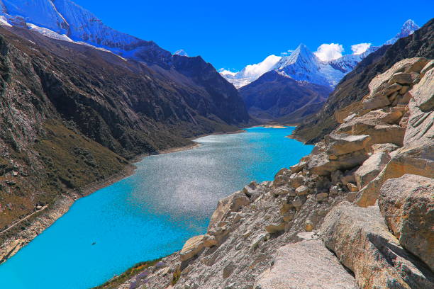 istock Above Paron lake and tiny boat with Pyramid mountain - Ancash, Peru 1088961928