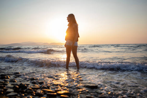 istock Beautiful Young Woman At Beach 1088965192