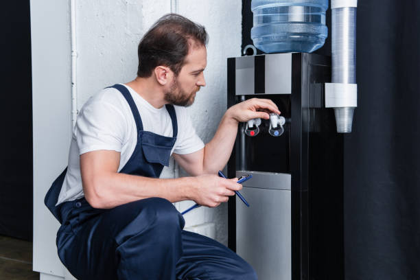 istock repairman with clipboard checking broken water cooler 1088965494