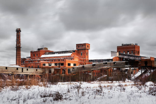 istock Old ruined factory construction in winter time. 1088965570