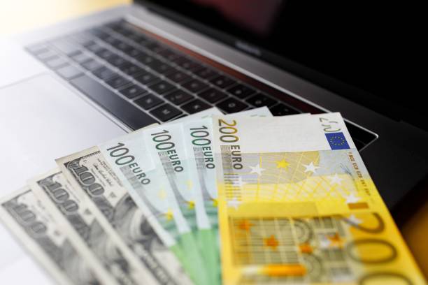 istock Background with american dollar and euro bills. 1088969592