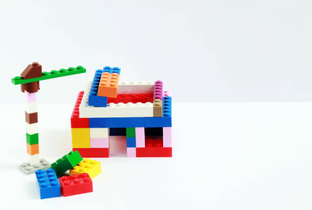 istock house in construction and crane built with toy blocks 1088972654