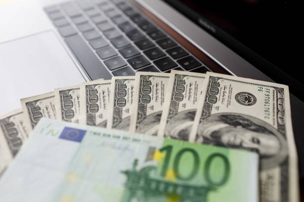 istock Background with american dollar and euro bills. 1088976320