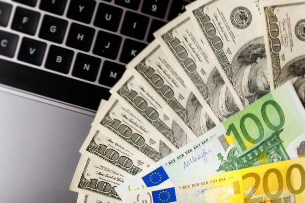 istock Background with american dollar and euro bills. 1088976332