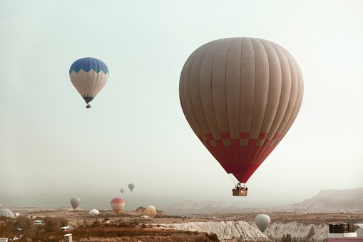 Travel. Beautiful Hot Air Balloon Flying In Sky Above Valley In Cappadocia View From Car. High Resolution