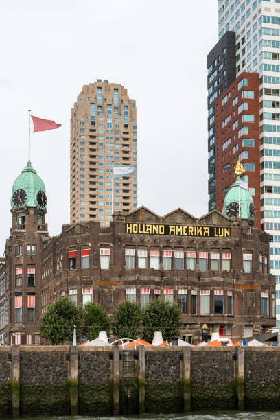 Rotterdam, Netherlands - August 04st, 2018: Rotterdams Kop van Zuid with Wilhelminapier and Hotel New York, the former headquarter of the Holland-America Line