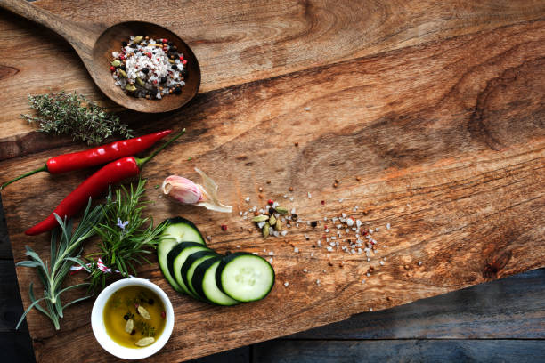 istock Spices and fresh cucumber on chopping board 1088991850