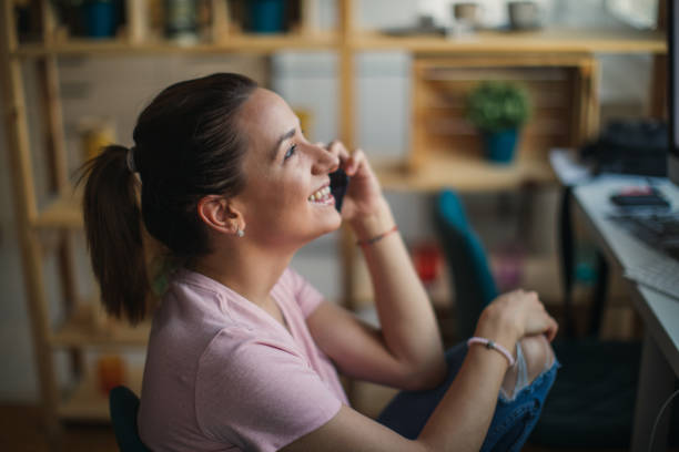 istock Young woman talking on mobile 1088992420