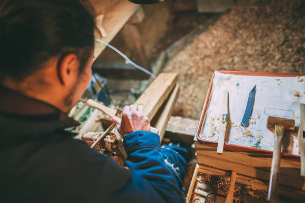 istock Asian man making craft from wood 1088994906