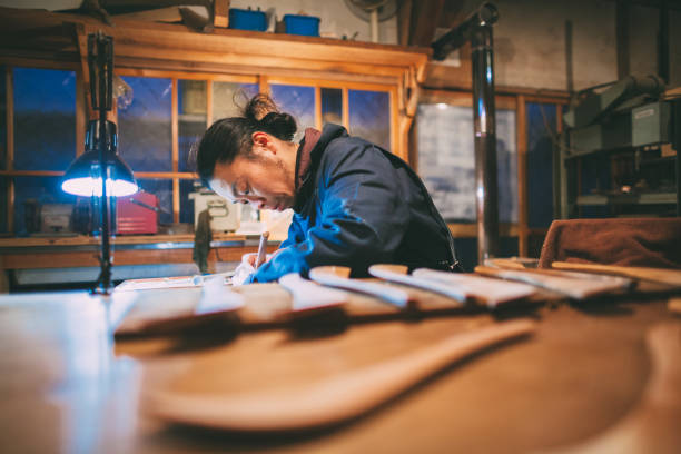 istock Asian man making craft from wood 1088995652