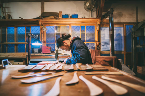 istock Asian man making craft from wood 1088997952