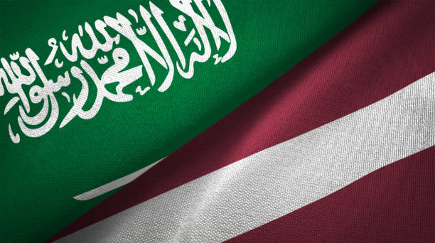 istock Latvia and Saudi Arabia two flags together realations textile cloth fabric texture 1089001676