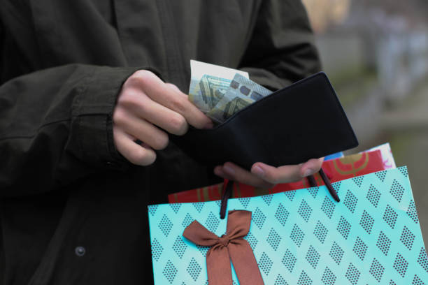 istock A man with a wallet in his hands 1089001780
