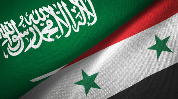 istock Syria Syrian Arab Republic and Saudi Arabia two flags together realations textile cloth fabric texture 1089003048