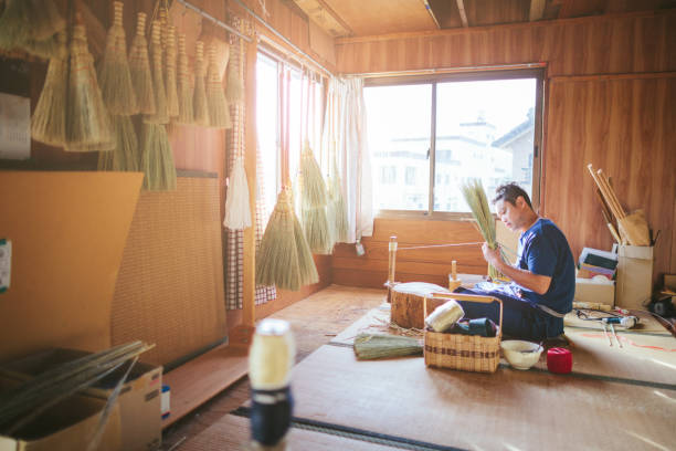 istock Asian man making broom in his working space 1089008680