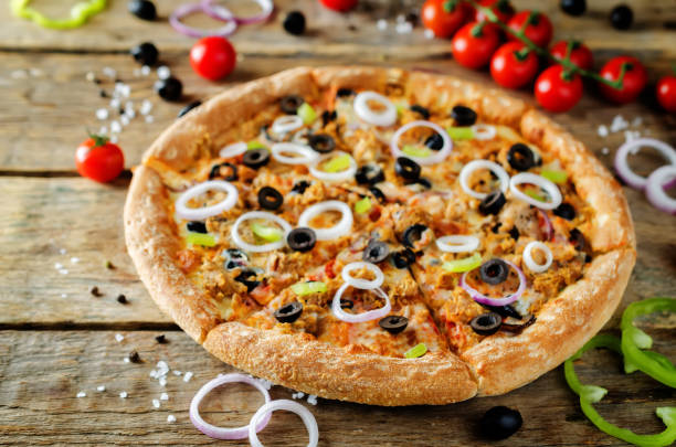 istock Pizza with tuna, olives, green pepper and red onion 1089010092