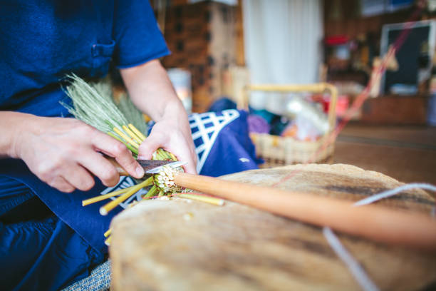 istock Asian man making broom in his working space 1089010596