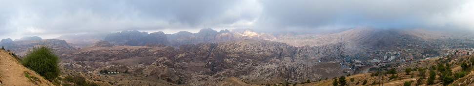 Wadi Musa, Jordan, December 07, 2018 : Panoramic view of the Red Mountains of Petra and settlements located near Petra in Jordan