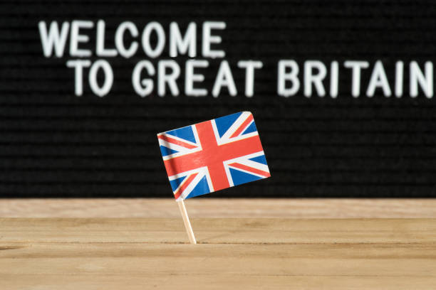 British flag and slogan Welcome to the UK British flag and slogan Welcome to the UK embassy photos stock pictures, royalty-free photos & images