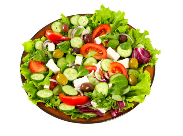 istock greek salad isolated on white 1089019142