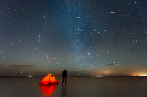 Gemini meteor shower 2018 over lake in Erenhot, Inner Mongolia, China Gemini meteor shower 2018 over lake in Erenhot, Inner Mongolia, China comet photos stock pictures, royalty-free photos & images