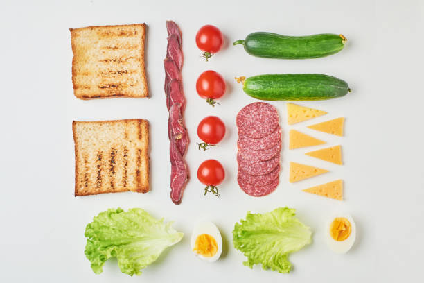 Sandwich ingredients on a white background, top view