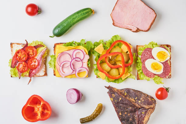 istock Different kind of sandwich and ingredients on a white background, top view 1089021550