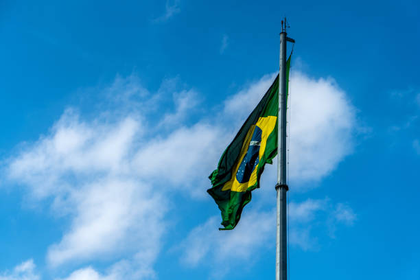 istock Brazilian Flag Waving Against a blue sky background. 1089026164