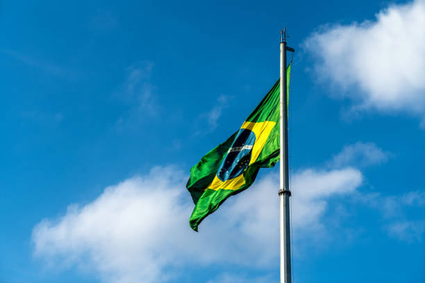 istock Brazilian Flag Waving Against a blue sky background. 1089026206