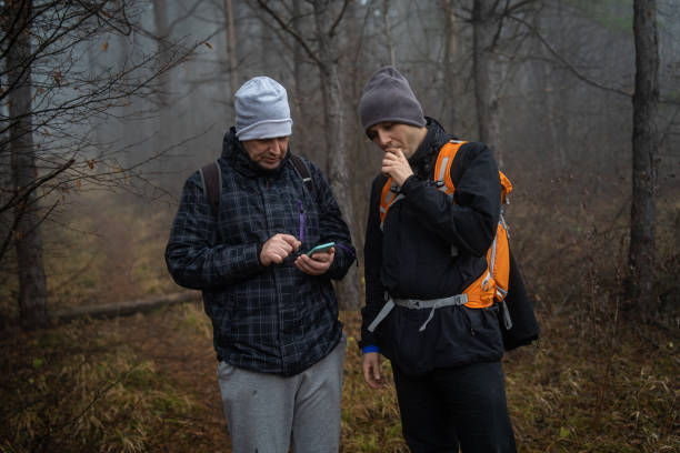 istock Hikers in foggy forest 1089026484