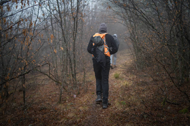 istock Hikers in foggy forest 1089026650
