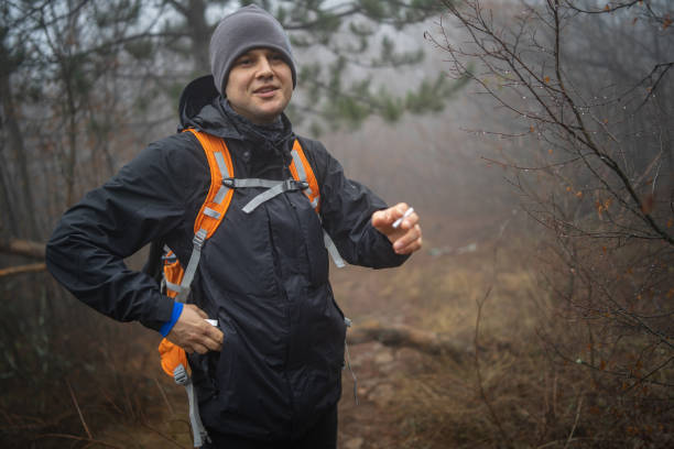istock Traveler with backpack walking in a foggy forest 1089028610